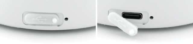 USB-C-Buchse an der Rückseite: links mit geschlossener Schutzkappe, rechts geöffnet – die Kappe hängt am Gehäuse
